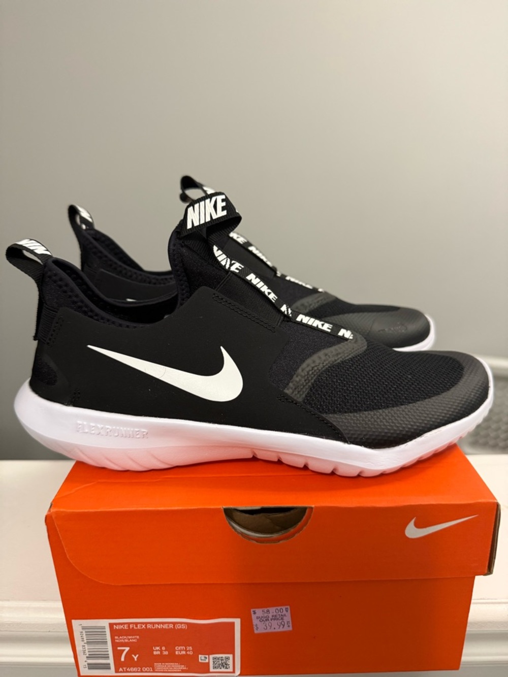 Nike Black and White Slip-On Flex Runner Sneakers